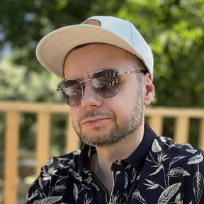 Patryk T. in a light cap and sunglasses
